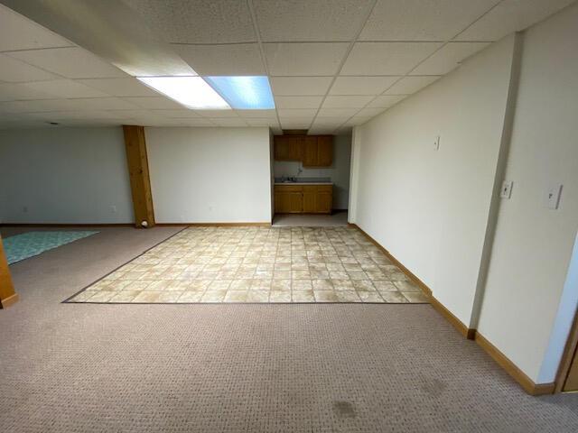 28379 Emerald Ct, Chesterfield, MI 48047 - finished basement with light carpet, a drop ceiling, and baseboards