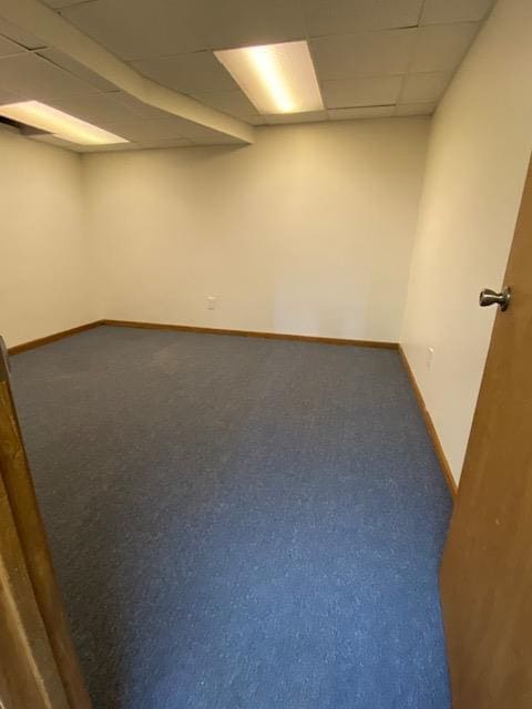 28379 Emerald Ct, Chesterfield, MI 48047 - empty room with a paneled ceiling, baseboards, and carpet floors