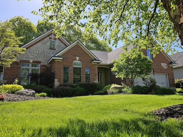 12250 Aleigha Dr NW, Grand Rapids, MI 49534 - view of front of house with brick siding, a front yard, an attached garage, and stone siding