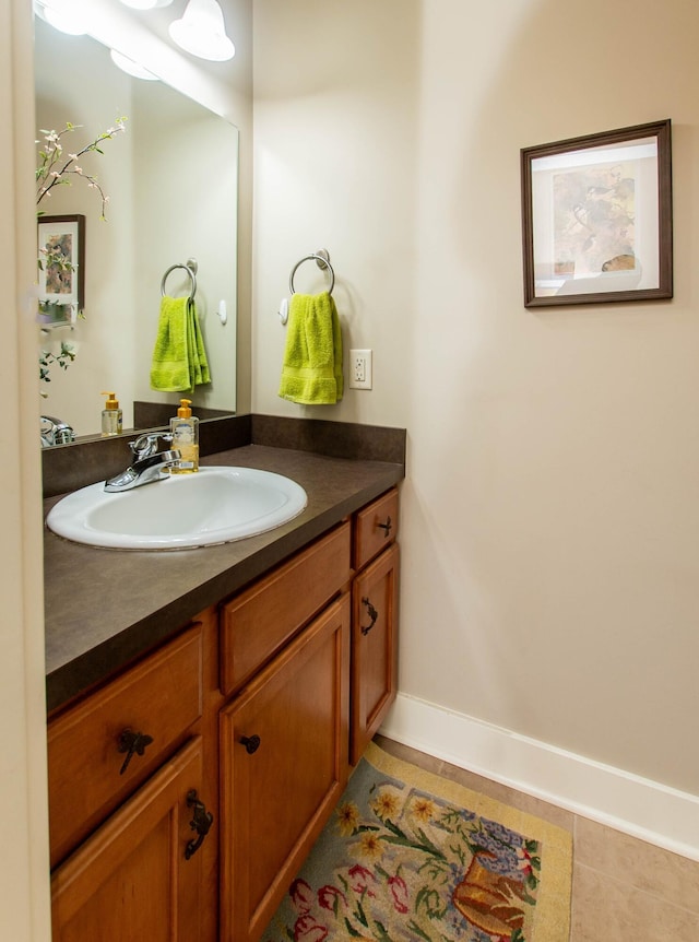 12250 Aleigha Dr NW, Grand Rapids, MI 49534 - bathroom featuring vanity, baseboards, and tile patterned flooring