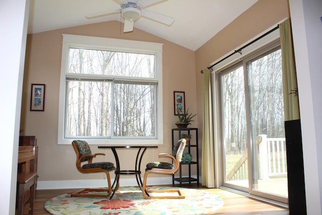 12250 Aleigha Dr NW, Grand Rapids, MI 49534 - sitting room featuring wood finished floors, ceiling fan, vaulted ceiling, and baseboards