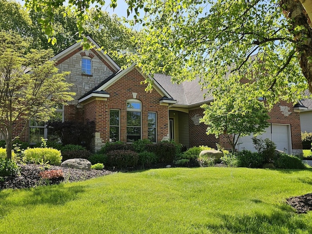12250 Aleigha Dr NW, Grand Rapids, MI 49534 - view of front of property featuring a front lawn, an attached garage, brick siding, stone siding, and a shingled roof