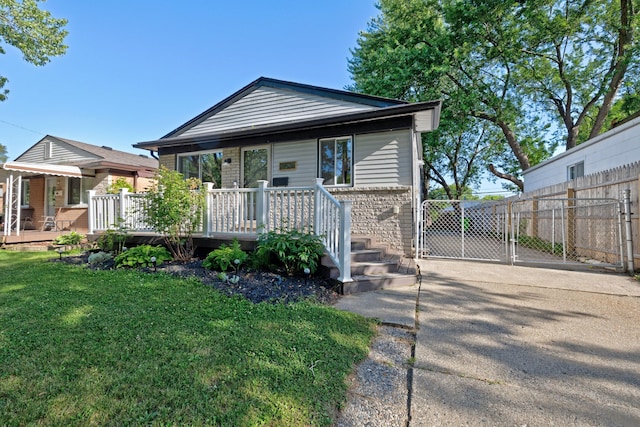 19526 Broadacres St, Clinton Township, MI 48035 - view of front of property with a gate, a wooden deck, and brick siding