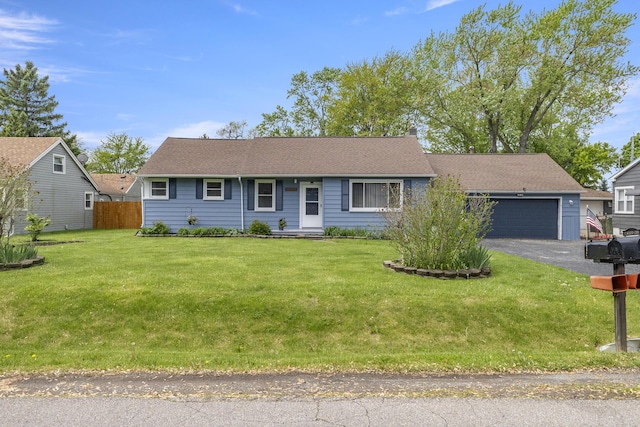 12550 Devoe St, Southgate, MI 48195 - ranch-style home with an attached garage and asphalt driveway