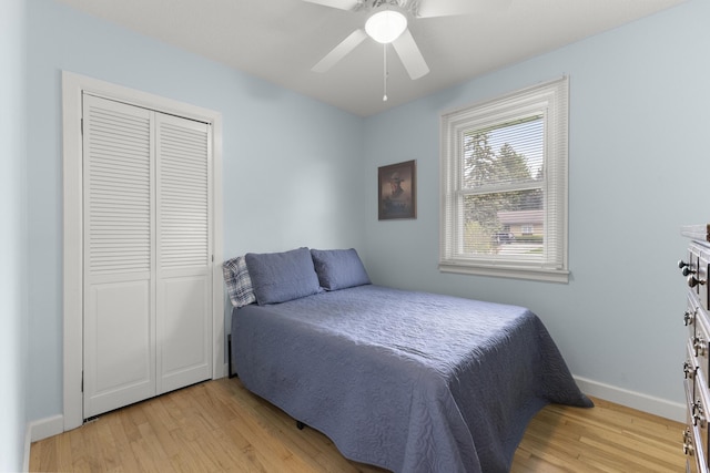 12550 Devoe St, Southgate, MI 48195 - bedroom with light wood-type flooring, baseboards, a closet, and ceiling fan