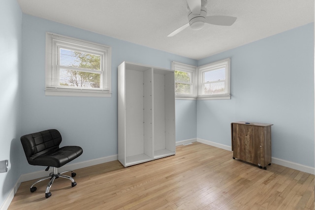 12550 Devoe St, Southgate, MI 48195 - bedroom with light wood-style floors, baseboards, and ceiling fan