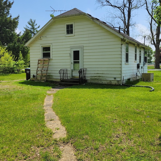1614 Mooreville Rd, Milan, MI 48160 - rear view of house with a lawn