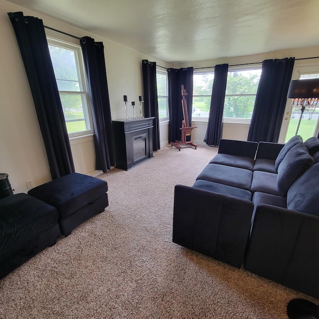 1614 Mooreville Rd, Milan, MI 48160 - living room featuring light carpet, healthy amount of natural light, and a fireplace