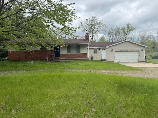 1666 Kile Rd, Metamora, MI 48455 - ranch-style home featuring driveway, a chimney, a garage, brick siding, and a front yard