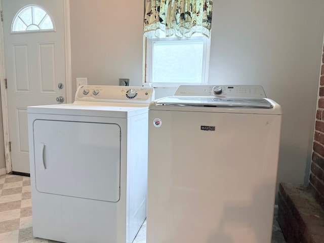 1666 Kile Rd, Metamora, MI 48455 - washroom featuring washing machine and clothes dryer and light flooring