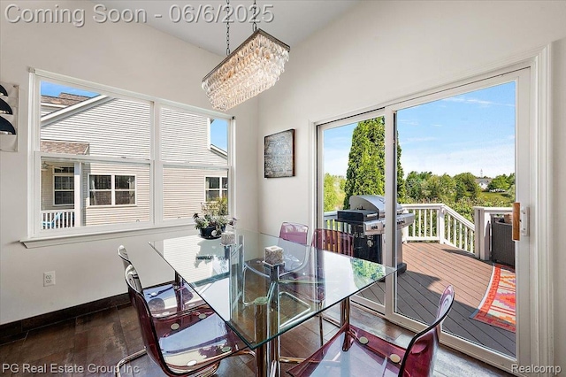 1226 Fountain View Ln, Oxford, MI 48371 - dining space with a chandelier, wood finished floors, and baseboards