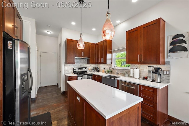 1226 Fountain View Ln, Oxford, MI 48371 - kitchen with stainless steel appliances, a sink, decorative backsplash, dark wood-type flooring, and light countertops