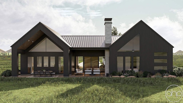 11400 Hillman, Davisburg, MI 48350 - rear view of property featuring a chimney, a patio, a lawn, and metal roof