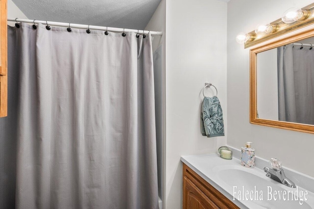 914 32nd St, Allegan, MI 49010 - bathroom featuring vanity, a textured ceiling, and a shower with curtain