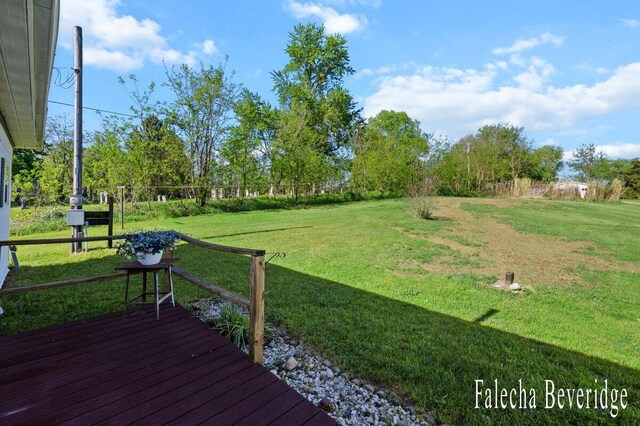 914 32nd St, Allegan, MI 49010 - view of grassy yard with a deck