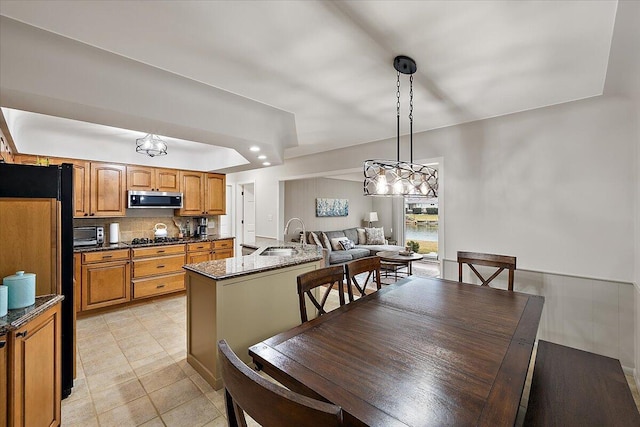 53383 Starlite Dr, Michigan, MI 48316 - dining area featuring light tile patterned floors and a chandelier