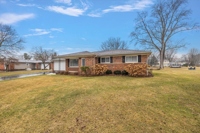 53383 Starlite Dr, Michigan, MI 48316 - ranch-style home featuring a garage, driveway, brick siding, and a front yard