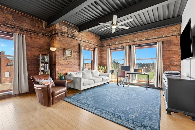 112 Watson St Unit 28, Detroit, MI 48201 - living room featuring brick wall, plenty of natural light, ceiling fan, beam ceiling, and light wood finished floors