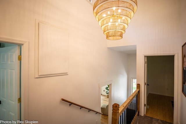2490 S Parsons Ave, Fremont, MI 49412 - stairway with a high ceiling and a chandelier