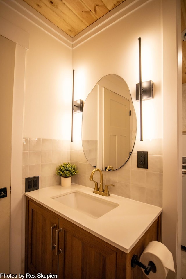 2490 S Parsons Ave, Fremont, MI 49412 - bathroom with backsplash, vanity, wooden ceiling, and tile walls