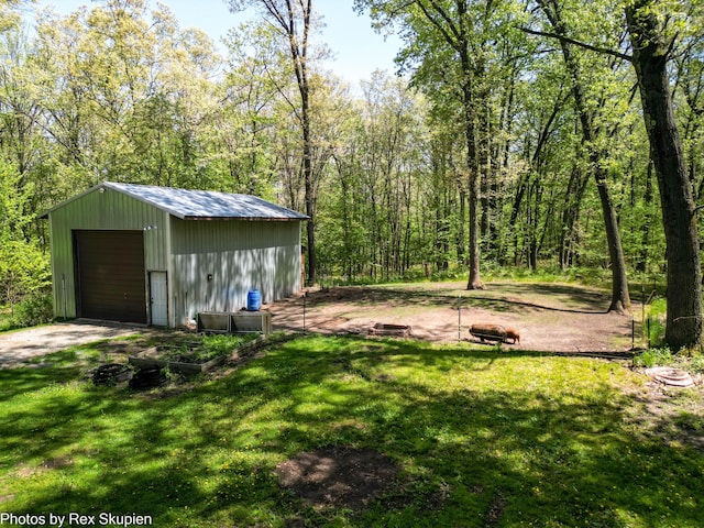 2490 S Parsons Ave, Fremont, MI 49412 - view of green lawn featuring an outbuilding and a garage