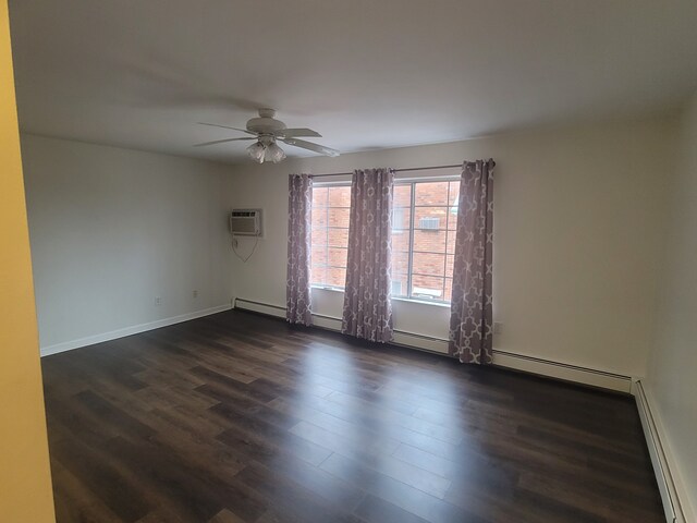417 Prospect Unit # 210, Romeo, MI 48065 - unfurnished room featuring a baseboard radiator, dark wood-style floors, ceiling fan, and a wall mounted AC