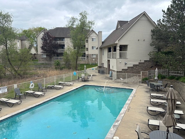 836 Brandon Ave, Pontiac, MI 48340 - community pool with a patio, fence, and central air condition unit