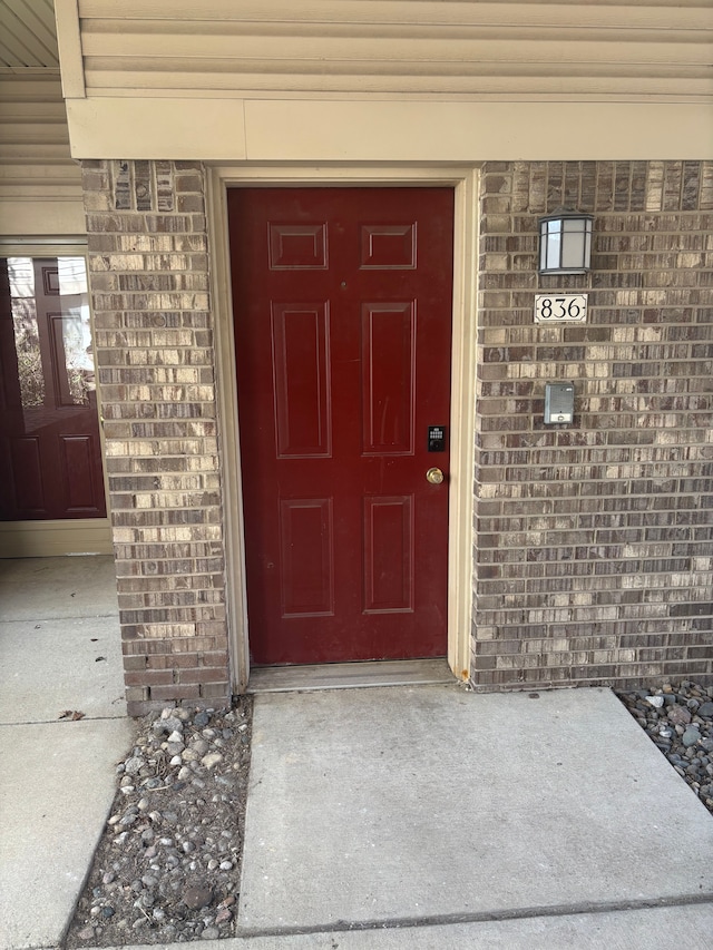 836 Brandon Ave, Pontiac, MI 48340 - doorway to property featuring brick siding