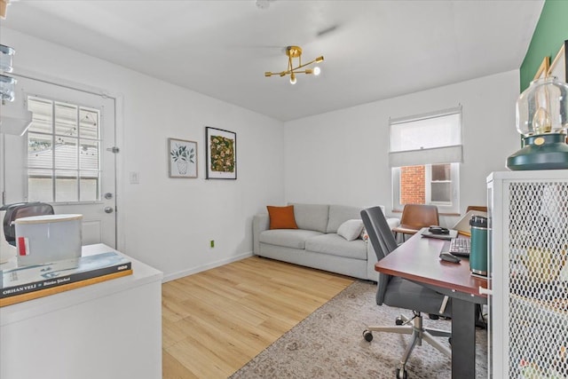 21111 Fleetwood Dr, Harper Woods, MI 48225 - office area featuring wood finished floors, a chandelier, and baseboards