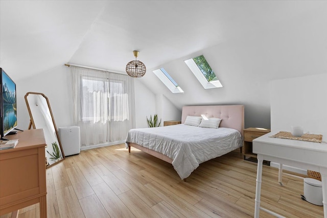 21111 Fleetwood Dr, Harper Woods, MI 48225 - bedroom featuring a skylight, multiple windows, light wood-type flooring, and lofted ceiling
