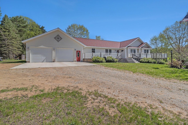 5094 Samerdar Dr, Onekama, MI 49675 - ranch-style house featuring driveway, a garage, a front yard, and a porch