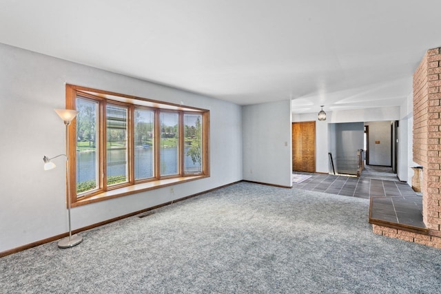 7500 Ore Knob Ct, Fenton, MI 48430 - unfurnished living room featuring carpet floors, baseboards, and a water view