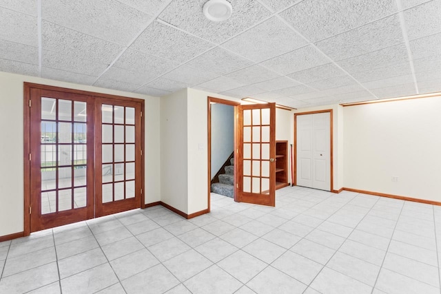 7500 Ore Knob Ct, Fenton, MI 48430 - spare room featuring baseboards, stairway, french doors, and a paneled ceiling
