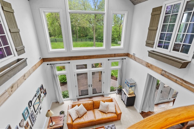 4263 Windmill Farms, Milford, MI 48380 - living room featuring a high ceiling, french doors, and baseboards