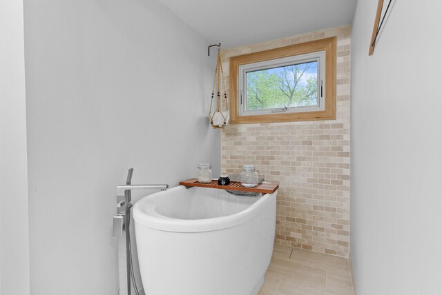4263 Windmill Farms, Milford, MI 48380 - bathroom with a freestanding tub and tile patterned floors