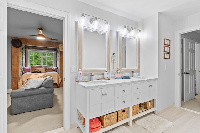 4263 Windmill Farms, Milford, MI 48380 - ensuite bathroom featuring double vanity, wood finished floors, ceiling fan, and baseboards