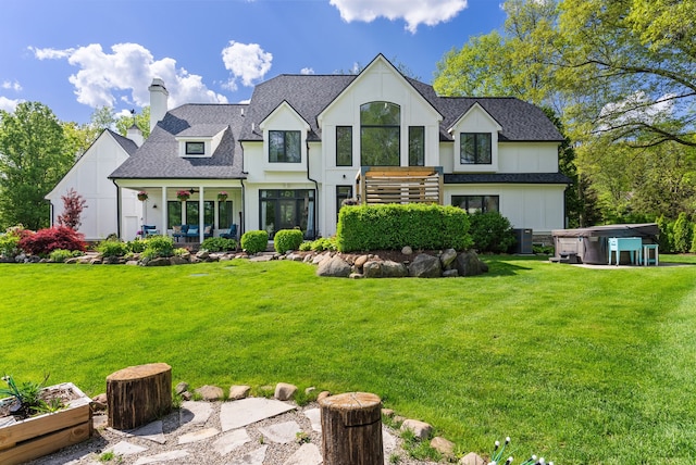 4263 Windmill Farms, Milford, MI 48380 - view of front facade featuring a chimney, a front lawn, central AC unit, and roof with shingles