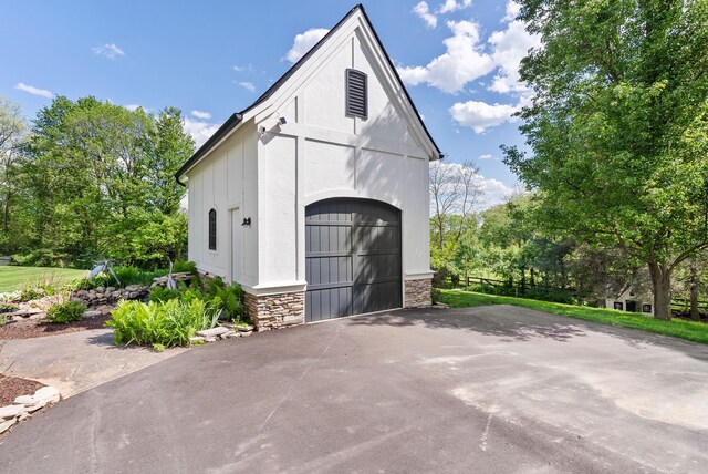4263 Windmill Farms, Milford, MI 48380 - garage with asphalt driveway
