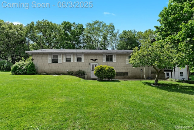 7109 Lake Shore Dr, Chelsea, MI 48118 - view of front of home featuring a front lawn and brick siding