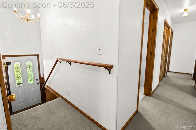 7109 Lake Shore Dr, Chelsea, MI 48118 - foyer featuring a chandelier, carpet floors, and baseboards