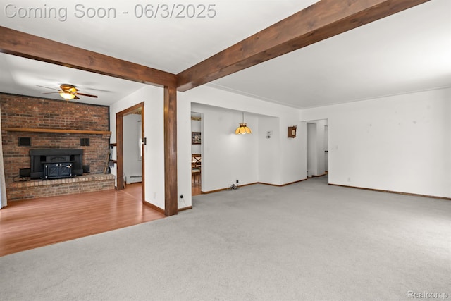 7109 Lake Shore Dr, Chelsea, MI 48118 - unfurnished living room featuring carpet, beamed ceiling, ceiling fan, baseboards, and a baseboard heating unit
