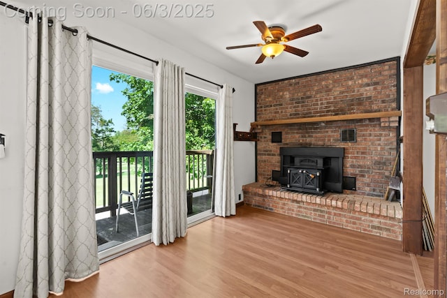 7109 Lake Shore Dr, Chelsea, MI 48118 - unfurnished living room featuring a ceiling fan and wood finished floors