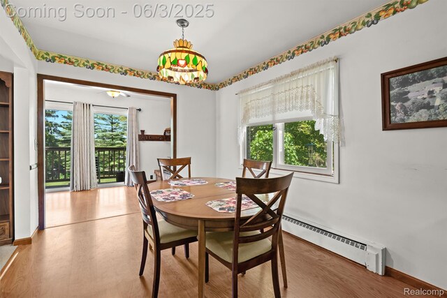 7109 Lake Shore Dr, Chelsea, MI 48118 - dining area with a baseboard heating unit
