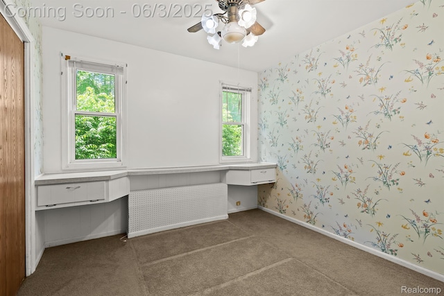 7109 Lake Shore Dr, Chelsea, MI 48118 - unfurnished office with plenty of natural light, carpet floors, ceiling fan, wallpapered walls, and baseboards