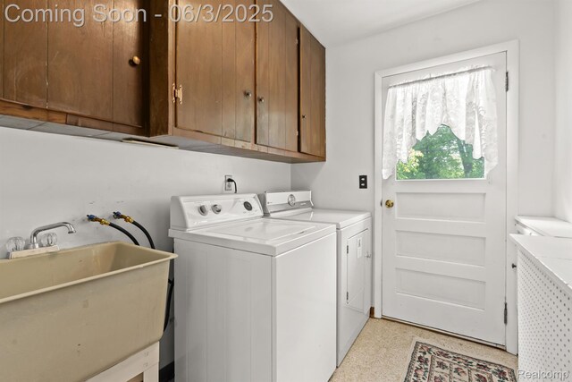 7109 Lake Shore Dr, Chelsea, MI 48118 - laundry area with cabinet space and washing machine and clothes dryer