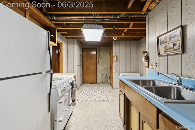 7109 Lake Shore Dr, Chelsea, MI 48118 - kitchen with white appliances, a sink, and light countertops