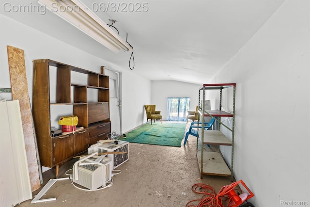 7109 Lake Shore Dr, Chelsea, MI 48118 - bedroom featuring lofted ceiling and concrete floors