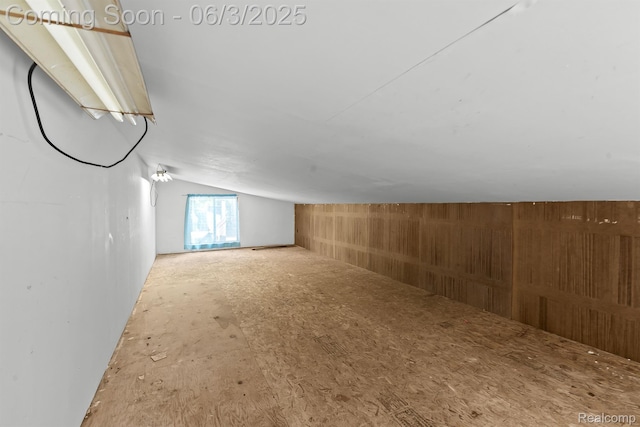 7109 Lake Shore Dr, Chelsea, MI 48118 - additional living space with vaulted ceiling and wooden walls