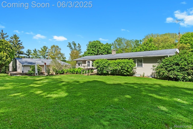 7109 Lake Shore Dr, Chelsea, MI 48118 - view of grassy yard featuring a deck
