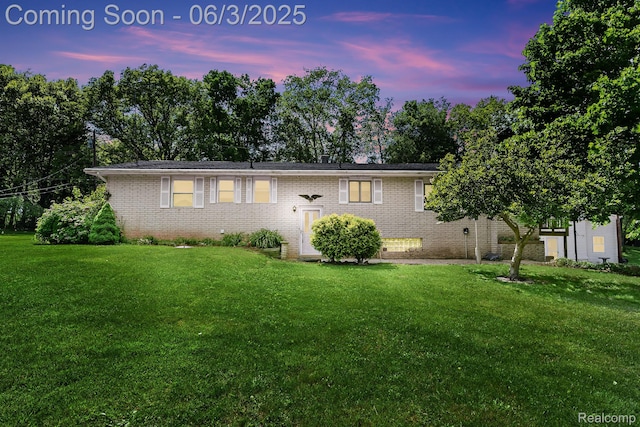 7109 Lake Shore Dr, Chelsea, MI 48118 - view of front of home featuring a front lawn and brick siding